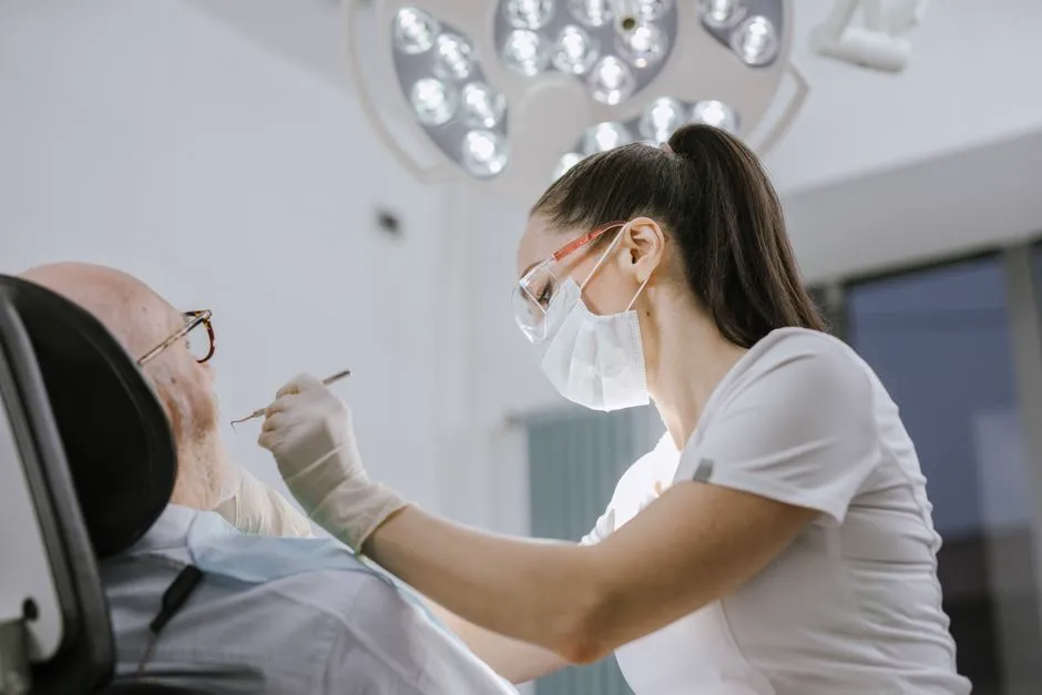 Dentist examining an elderly patient in a dental clinic